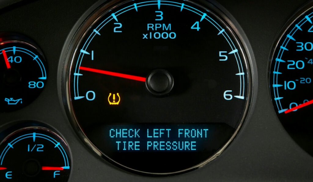 TPMS sensor lifespan warning light shown on a car dashboard