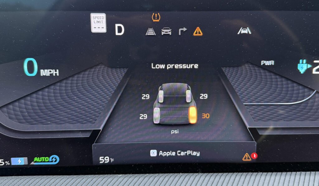 alt="TPMS Light on: Tire Pressure Monitoring System warning light displayed on car's dashboard