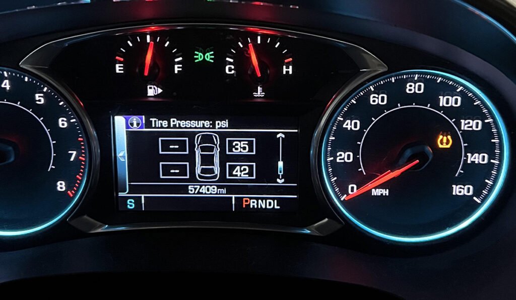 TPMS Tool dashboard with illuminated tire pressure warning light