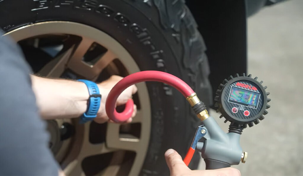 Inflating the tire after you Replace TPMS Sensor, showing proper air pressure adjustment for accurate tire pressure monitoring.