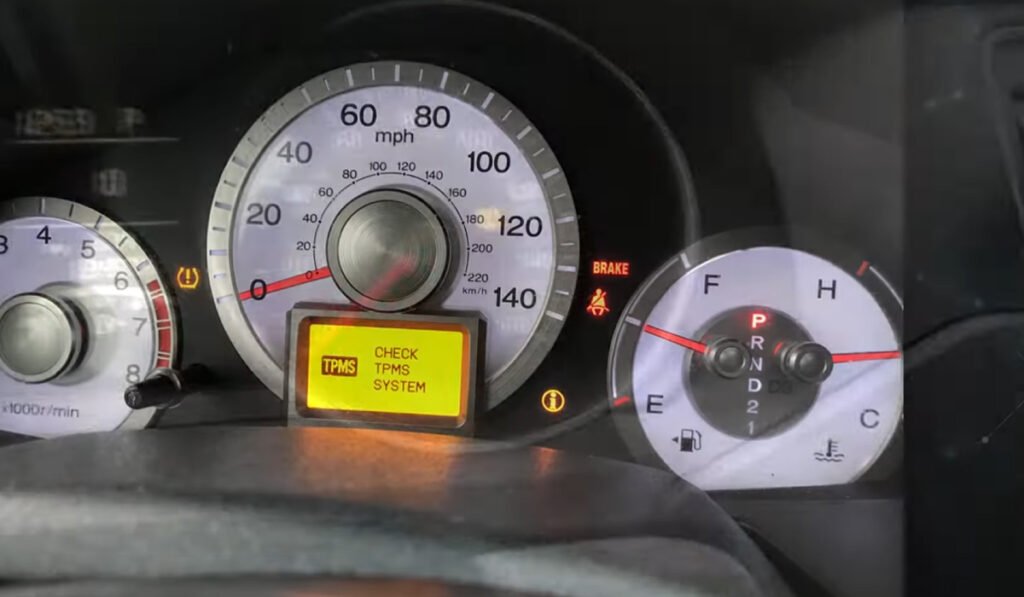 Car dashboard TPMS warning light showing tire pressure alert (solid and flashing)